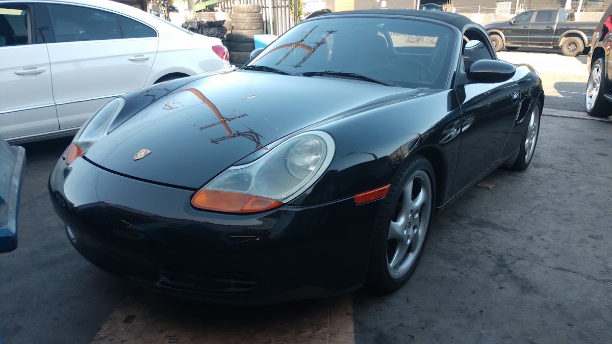 Black Porsche Boxster in the shop